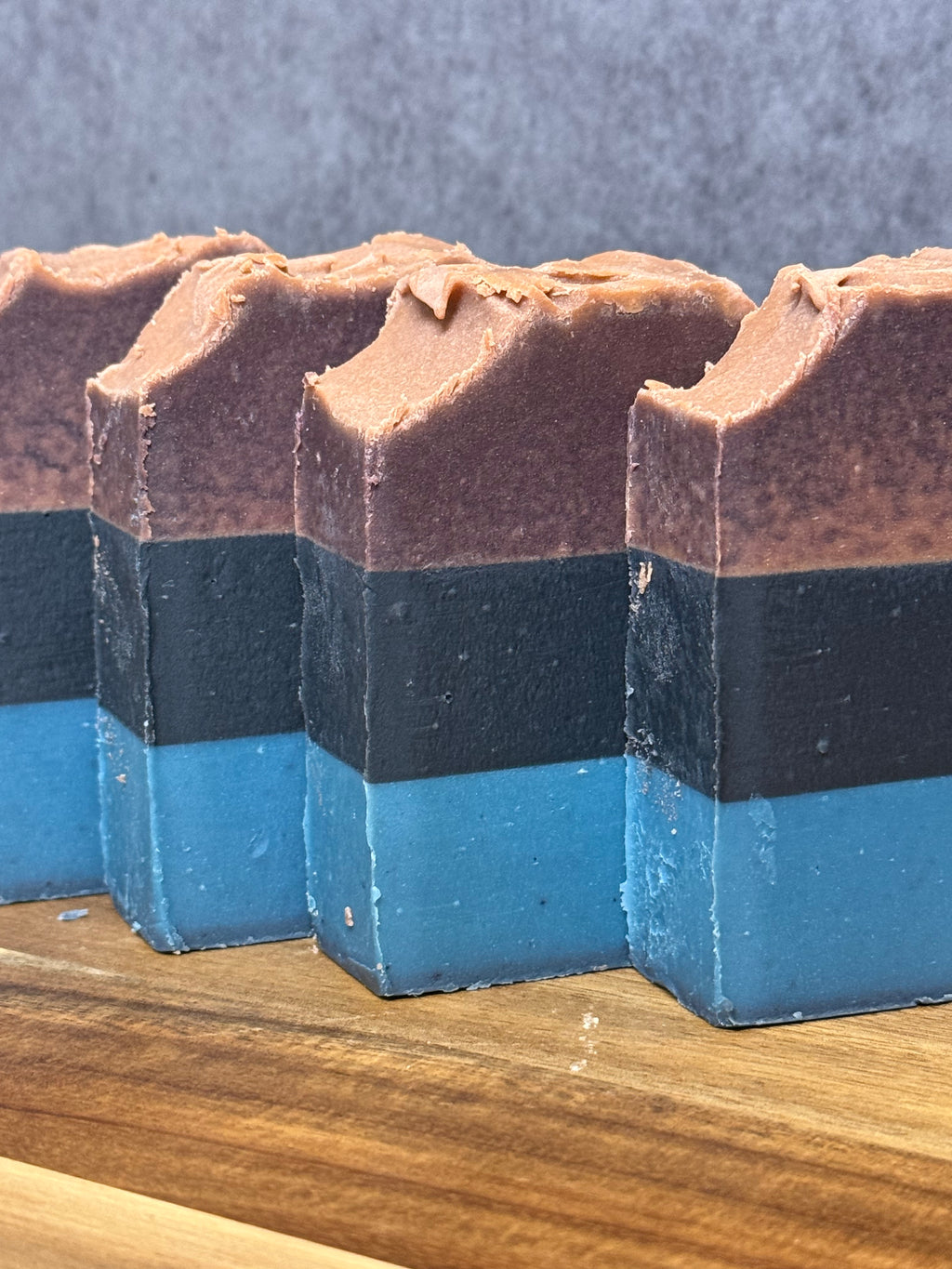 Layered tallow soap with activated charcoal